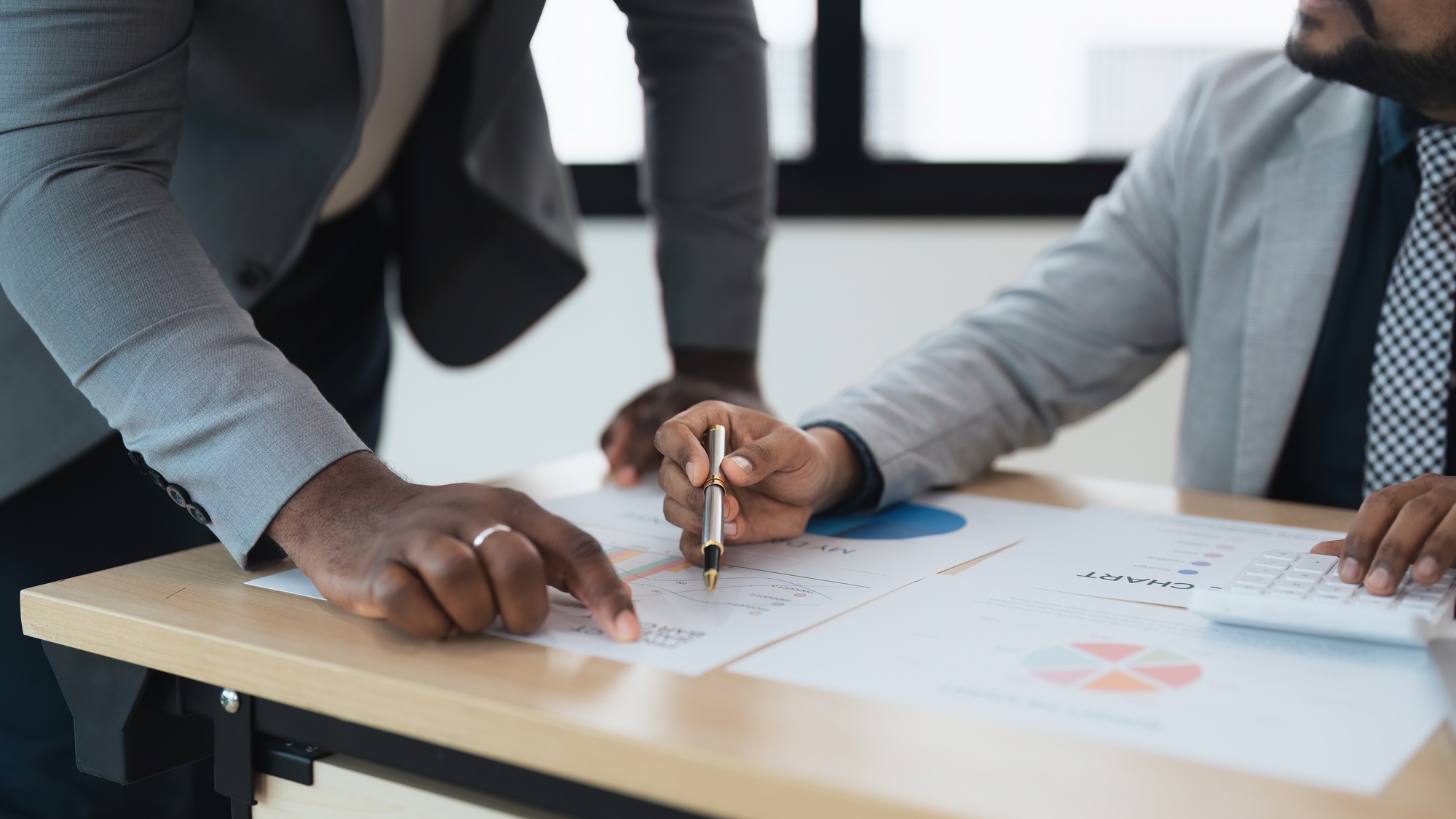 Business people indian and african american worker looking discussing corporate strategy in