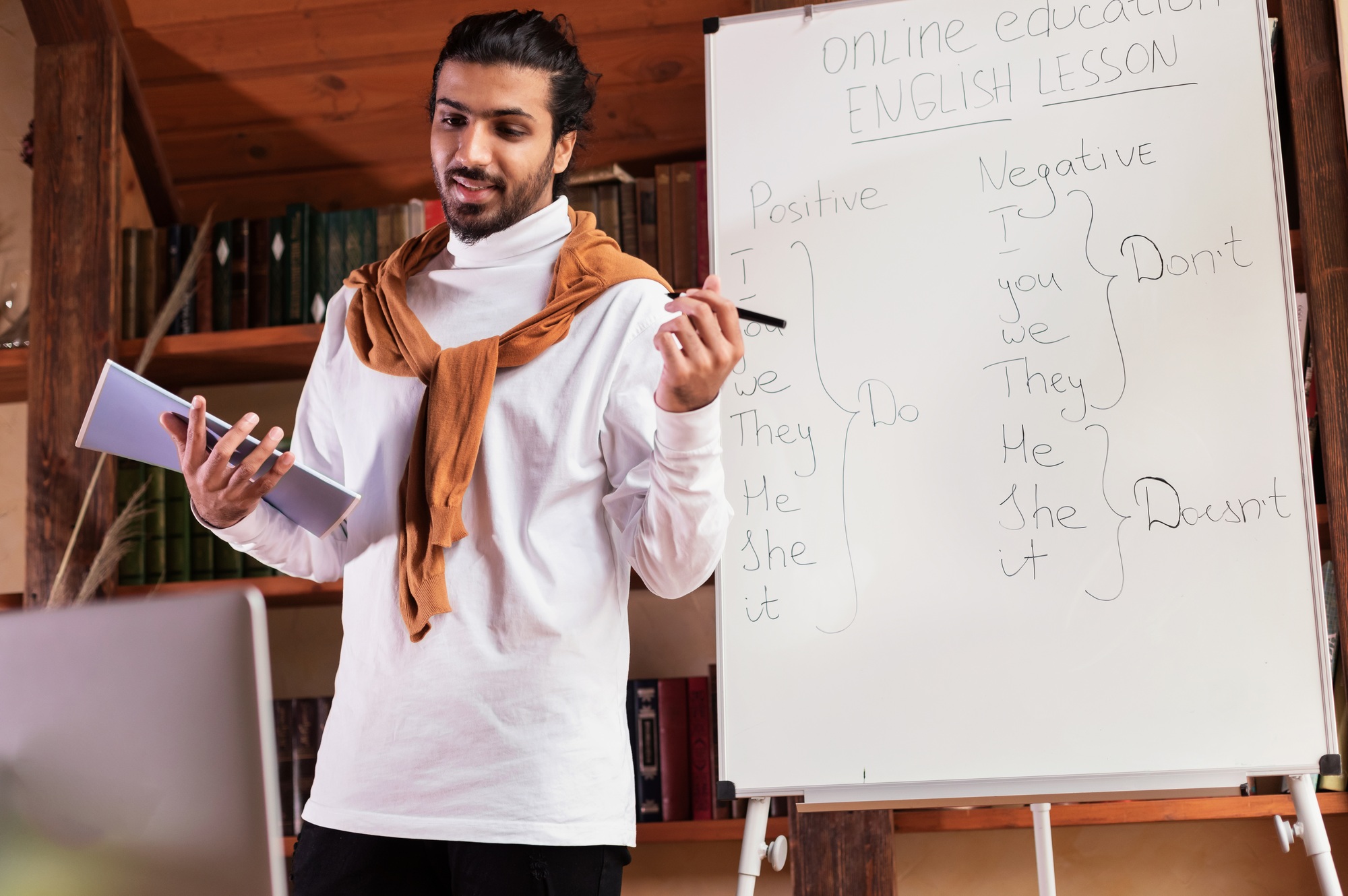 Indian Teacher Teaching Online Standing Near Blackboard Having Webinar Indoors